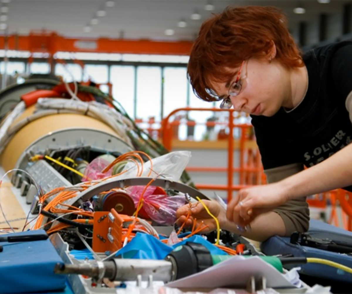 Technician Works With Aircraft Cables